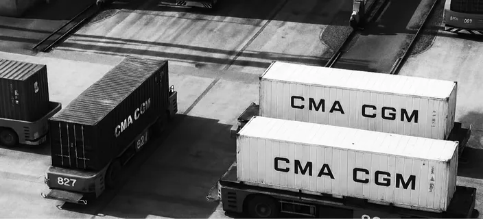 Two CMA CGM containers on terminal trucks